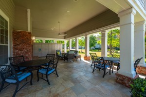 One Bedroom Apartments for Rent in Conroe, TX - Covered Outdoor Seating Area  & Package Hub      
